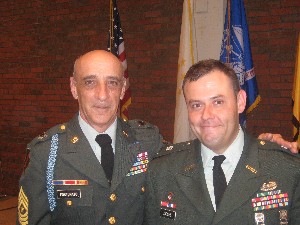 Sgt. Maj. Gary Fortunato, USA (l), congratulates Cadet George Jacome, Army ROTC, at the 2008 Patriot Battalion awards ceremony in May.